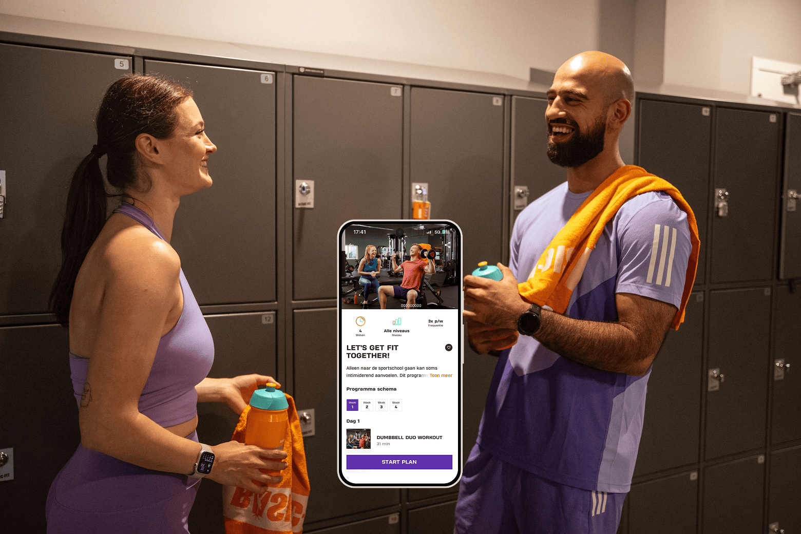 Two people in gym locker room smiling and holding water bottles, with a smartphone screen in the center displaying a workout app called “Let’s Get Fit Together!” showing a dumbbell duo workout program.